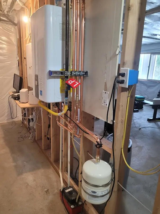 Licensed plumber repairing a kitchen sink in Islip