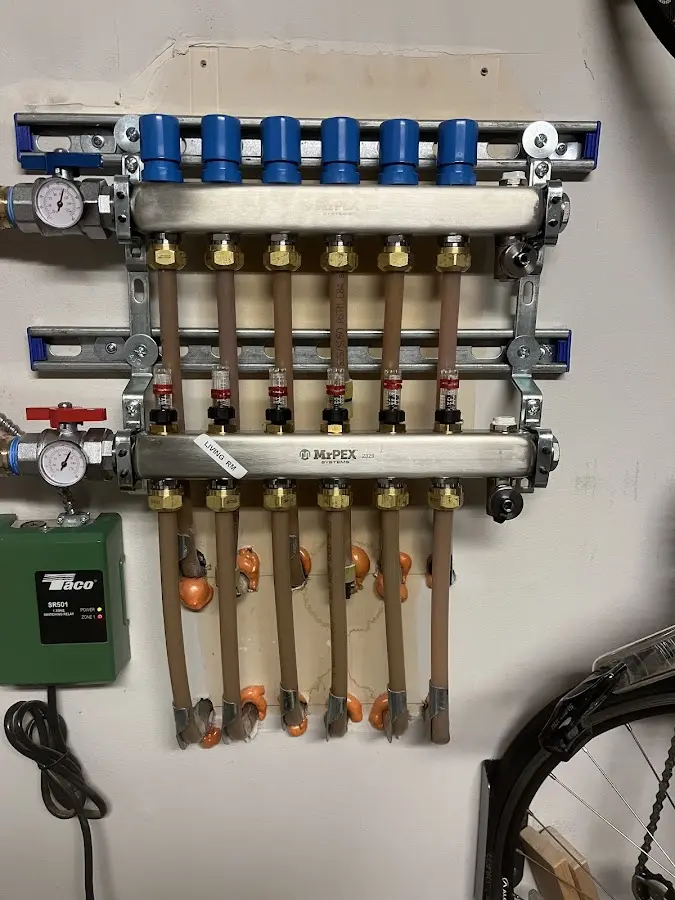 Plumber performing Water Heater Repair at a residential property in Islip