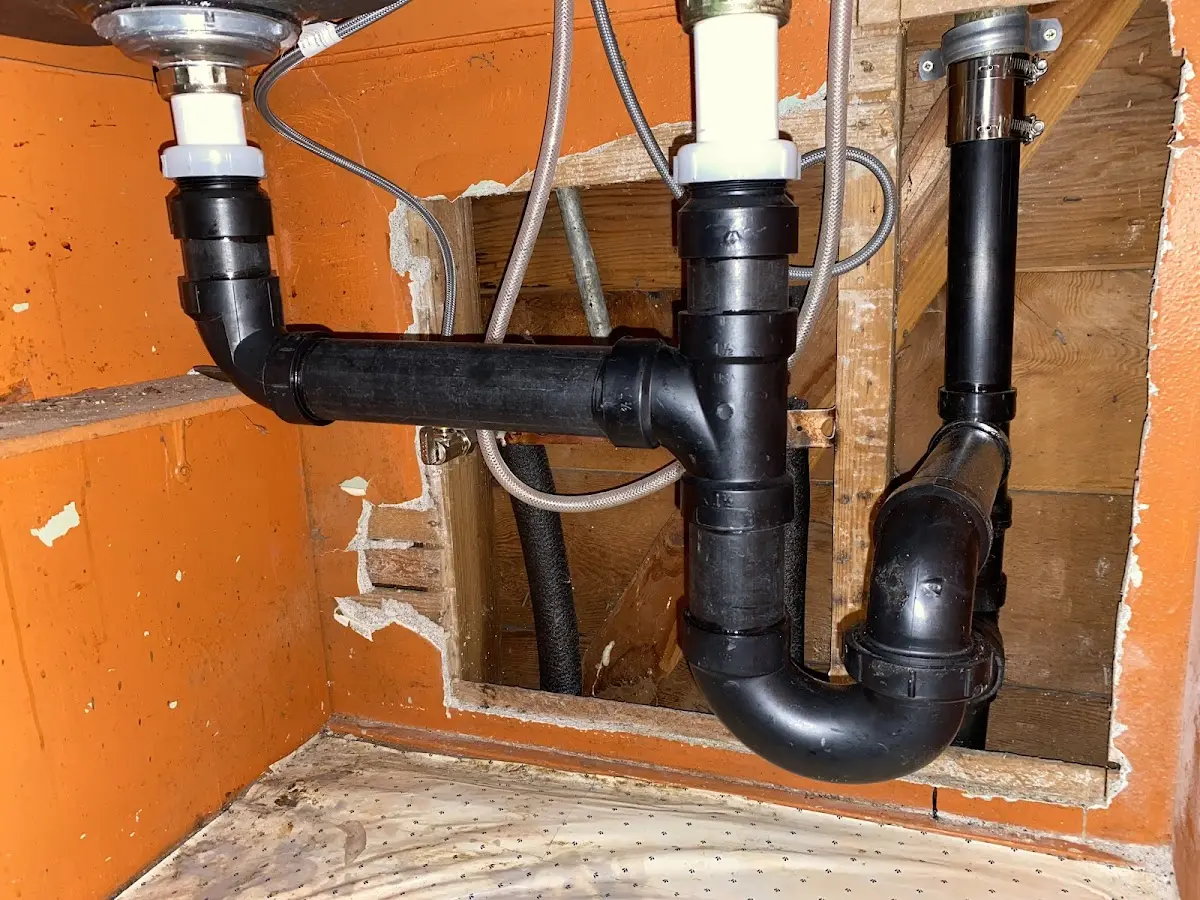 Professional Garbage Disposal Repair equipment and tools on the job in Islip